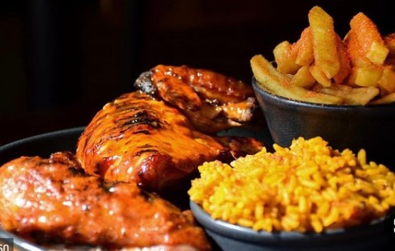 1/2 Grilled Chicken on flame served with rice and French Fries for 1 person